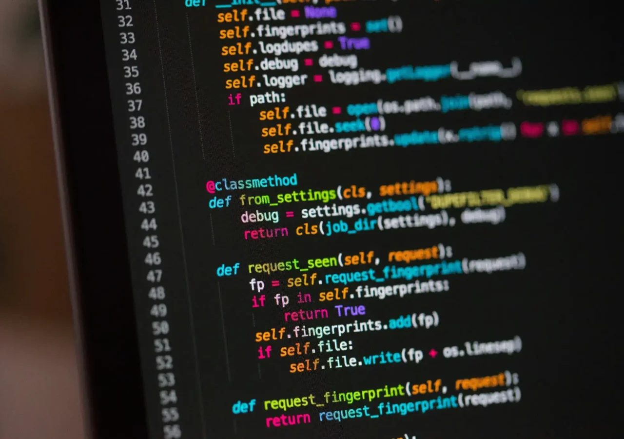 Close-up of colorful programming code displayed on a computer screen.
